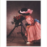 ANNE GEDDES Justine Smelling Roses on Bike, 1994